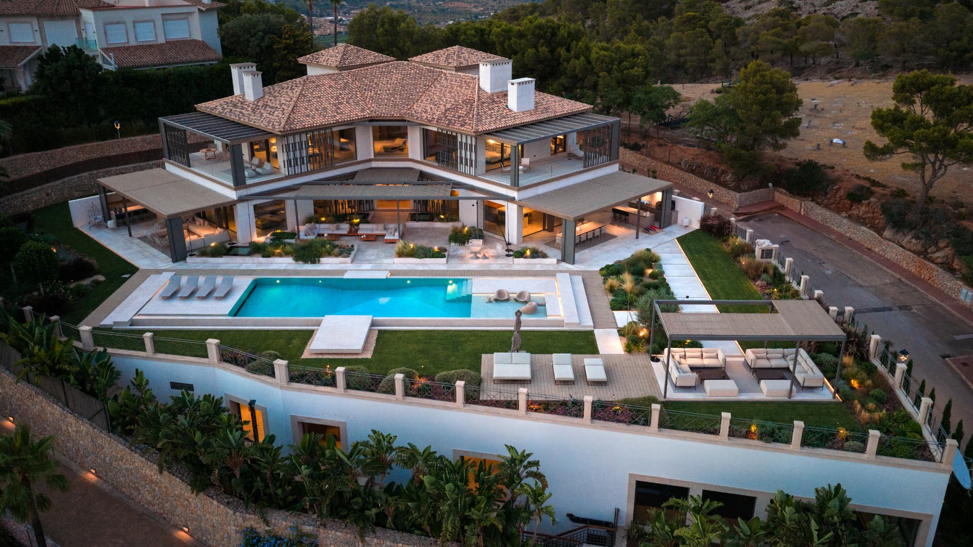 Las Brisas villa and pool at dusk, aerial view