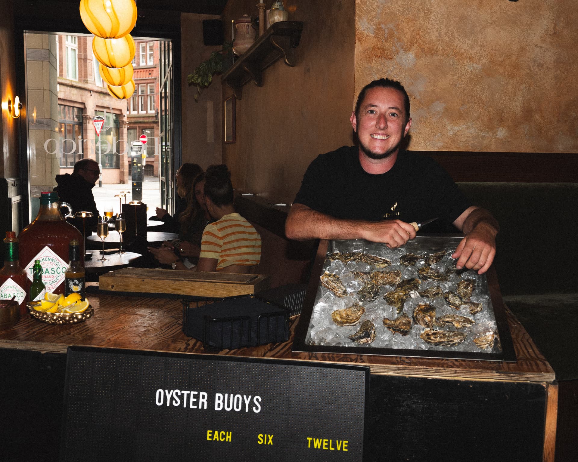 Shucker at the Oyster Buoys stand at Federico's Oyster event