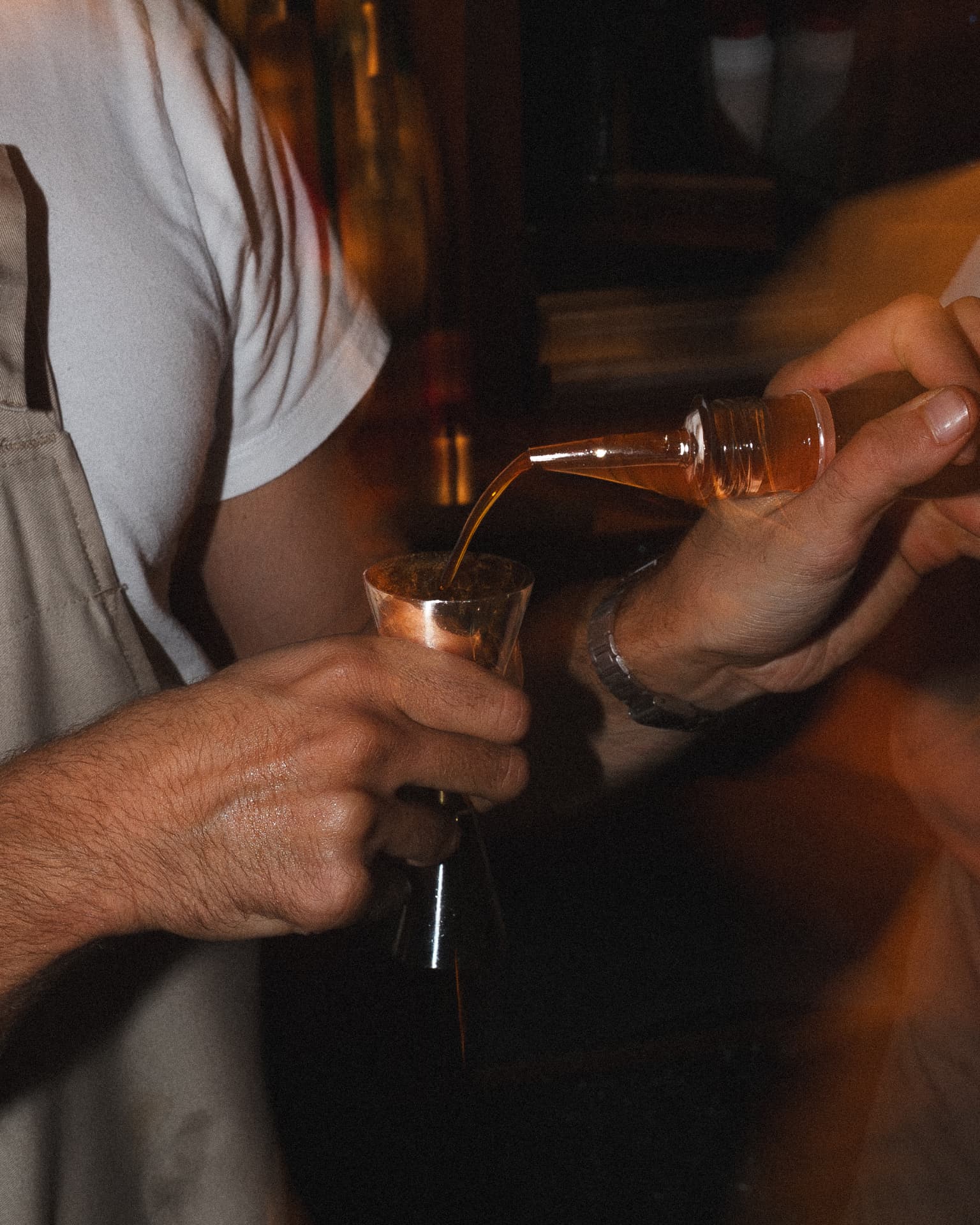 Bartender pouring a measure at Federico's Oyster event